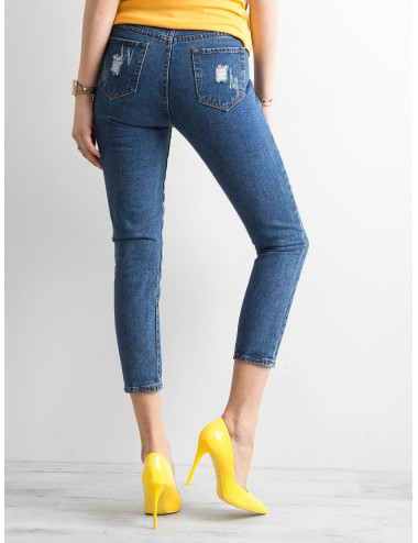Ciemnoniebieskie spodnie ankle jeans z przetarciami 
