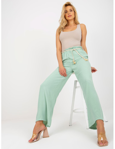 Light green fabric swedes pants with thin belt  