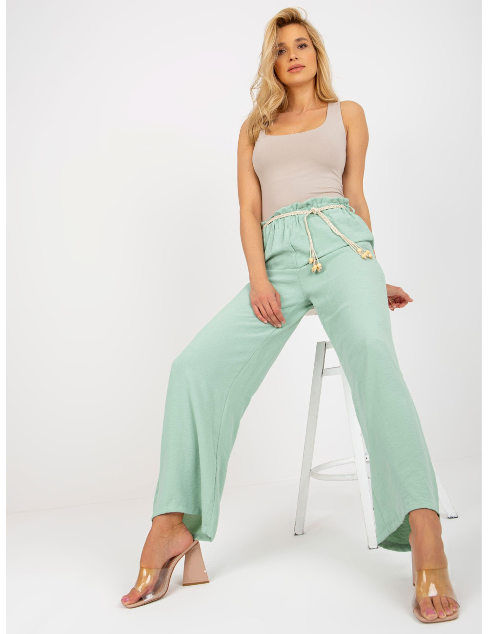 Light green fabric swedes pants with thin belt  