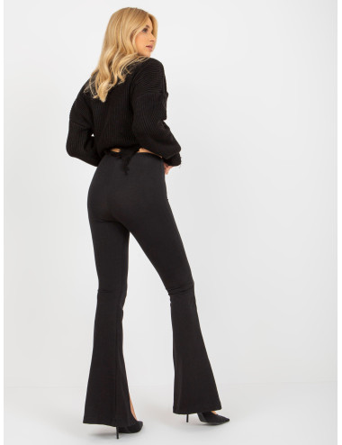 Black flared leggings with slits and elastic band at the waist 