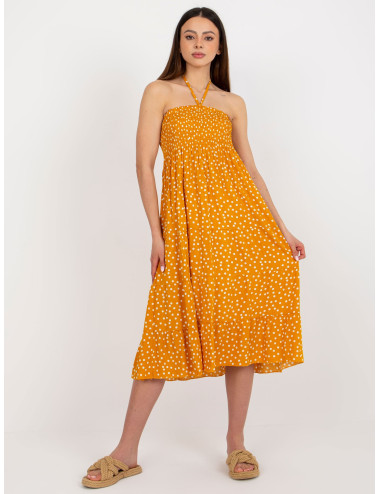 Yellow summer dress with polka dots tied around the neck 