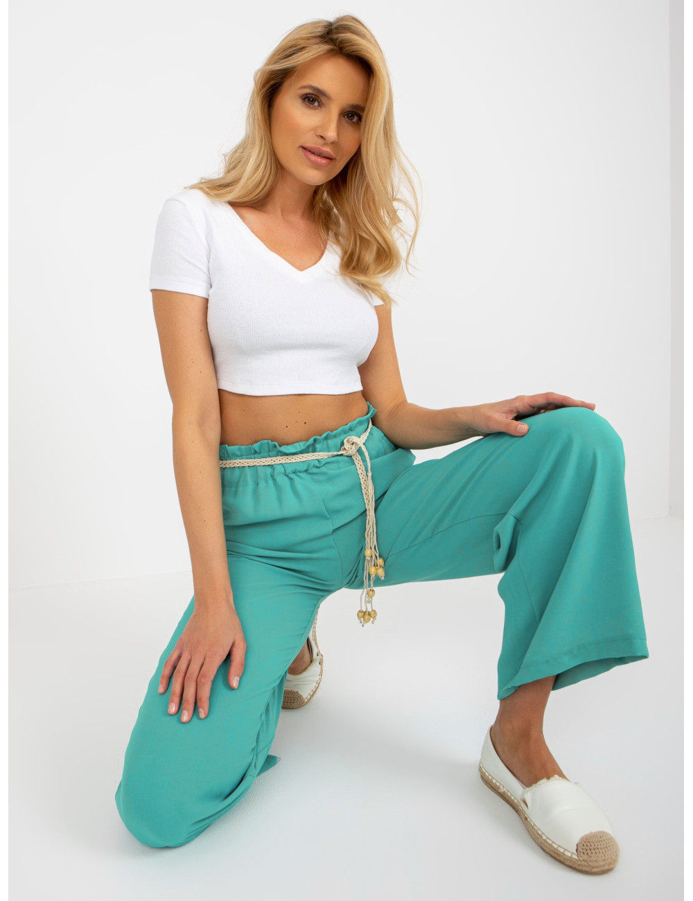 Turquoise fabric swedes pants with braided belt  