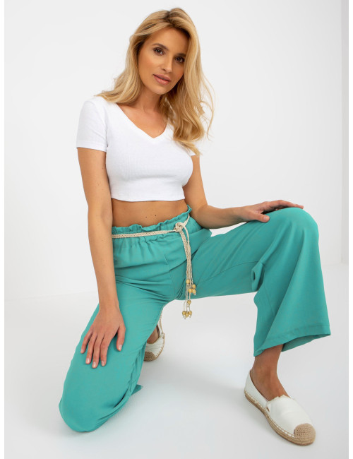 Turquoise fabric swedes pants with braided belt  